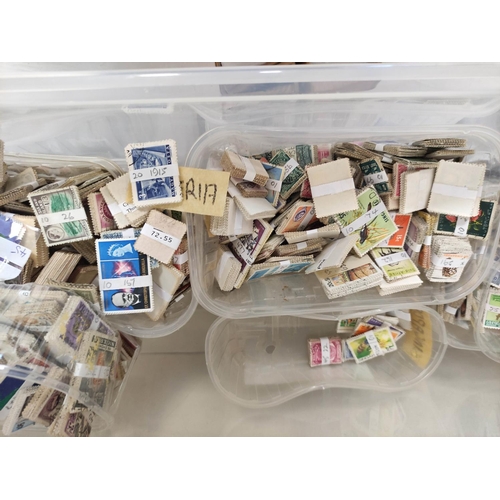 276 - Two boxes containing a huge collection of world postage stamps from the estate of a local collector.... 