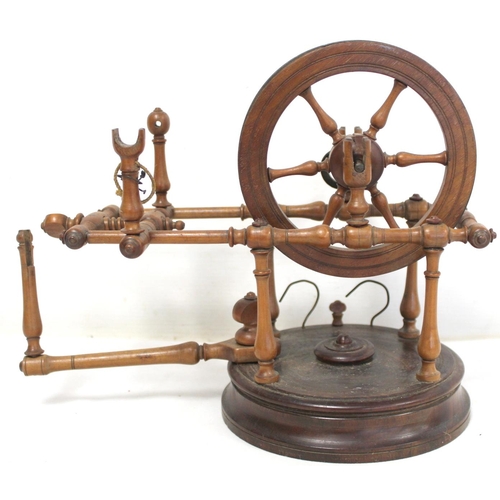 264 - Early 19th century treen bobbin winder with spoked wheel on circular plinth base, 25cm high; also a ... 