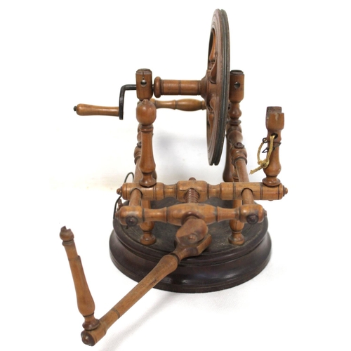 264 - Early 19th century treen bobbin winder with spoked wheel on circular plinth base, 25cm high; also a ... 