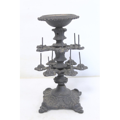 275 - Victorian cast iron reel stand of two tier form with circular top (lacking pin cushion pad), on dome... 