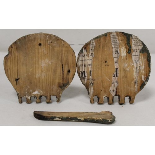 296 - Two antique naïve carved treen Memento Mori skull plaques with traces of painted decoration, ea... 