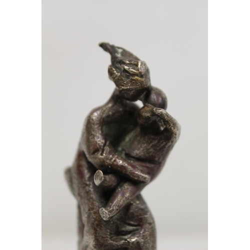 298 - 20th century cast bronze figure of a mother and child mounted on rectangular green marble plinth bas... 