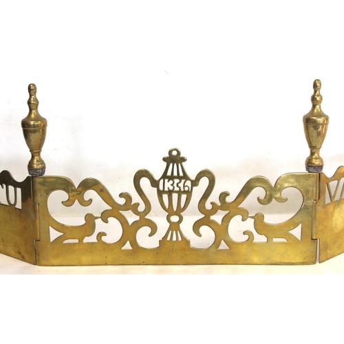 319 - Unusual antique brass three panelled hinged fender with baluster finials and pierced decoration and ... 