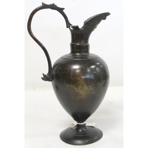 321 - Antique Continental bronze wine ewer, probably Italian 16th century, of baluster form with mask head... 