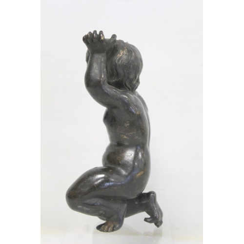 322 - Cast bronze figure of a putto wrestling with a serpent, on naturalistic plinth base, a.f., 27cm high... 