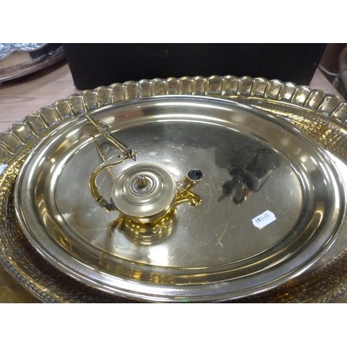 86 - Three brass trays including Indian-style tray, lamp, metal and wood-handled flat iron etc.