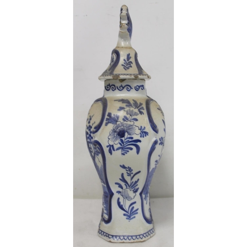 521 - Dutch Delft De Klaauw blue and white covered vase of baluster form, decorated in the Chinese manner ... 