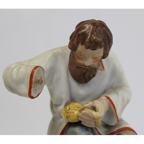 524 - Russian Moscow/Gardner bisque porcelain figure of a seated man braiding lapti (bast shoes). Painted ... 