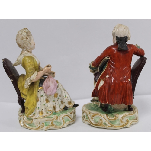 525 - Pair of 19th century porcelain figures of a seated boy reading a book and girl tatting, in 18th cent... 