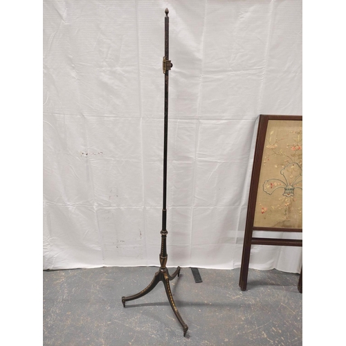 532 - 19th century ebonised wood pole screen stand on a tripod base; also a mahogany and silk two section ... 