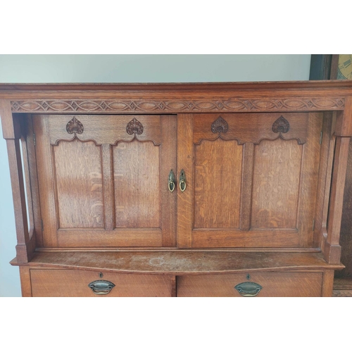 560 - Attributed to Arthur Simpson of Kendal. Arts & Crafts oak side cupboard with plain pediment and ... 