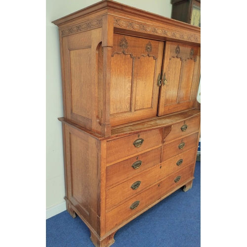 560 - Attributed to Arthur Simpson of Kendal. Arts & Crafts oak side cupboard with plain pediment and ... 