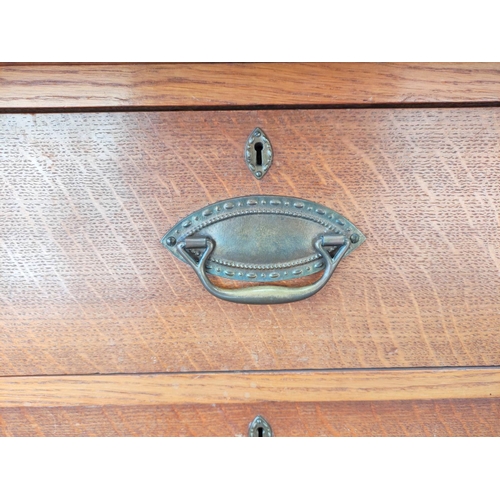 560 - Attributed to Arthur Simpson of Kendal. Arts & Crafts oak side cupboard with plain pediment and ... 