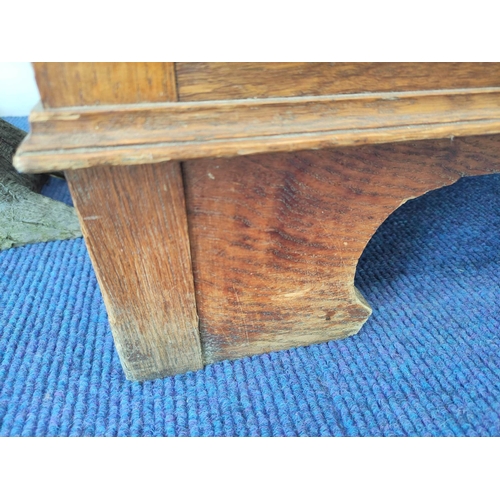 560 - Attributed to Arthur Simpson of Kendal. Arts & Crafts oak side cupboard with plain pediment and ... 