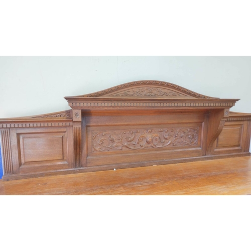 561 - Late 19th century light oak sideboard, the arched raised back with dentil cornice and foliate carved... 