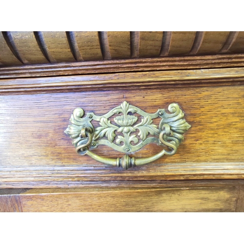 561 - Late 19th century light oak sideboard, the arched raised back with dentil cornice and foliate carved... 