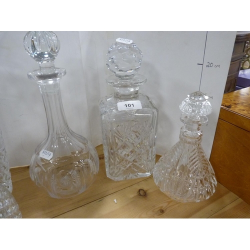 101 - Three assorted crystal and cut glass decanters with stoppers, cut glass vase and a smaller decanter ... 
