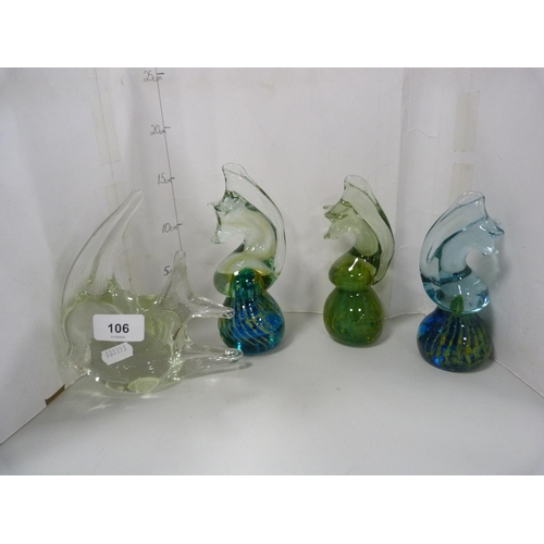 106 - Three Mdina glass seahorse paperweights and another glass paperweight modelled as a fish.  (4)