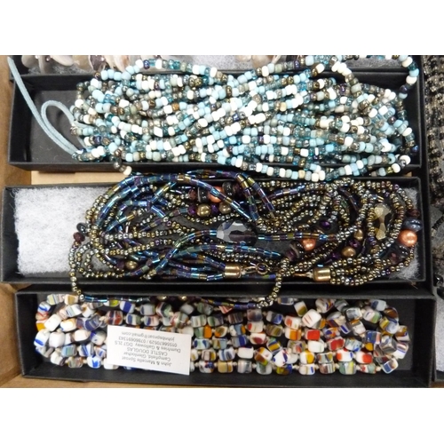 114 - Tray of bead necklaces including one with a jade-type disc pendant.