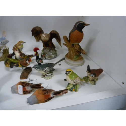 133 - Collection of bird ornaments including six Beswick birds and others (one shelf).