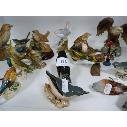 133 - Collection of bird ornaments including six Beswick birds and others (one shelf).
