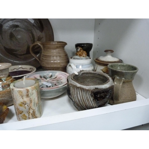 160 - Studio pottery jugs, vases, mineral pen stand, large plate etc (one shelf).