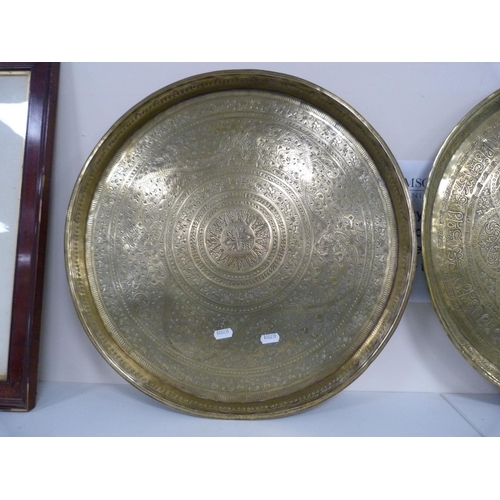 163 - Two middle eastern brass chargers.