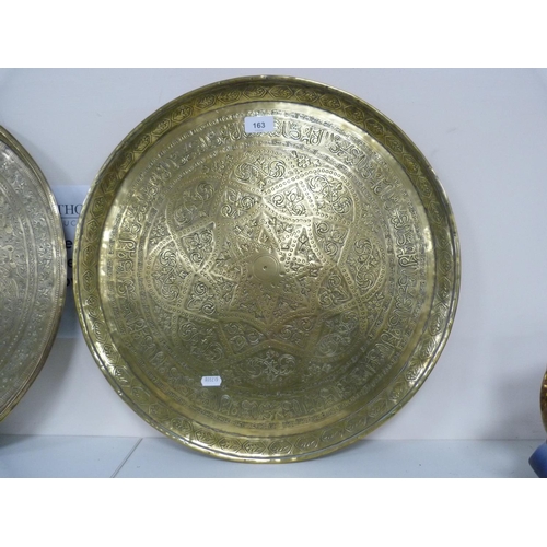 163 - Two middle eastern brass chargers.