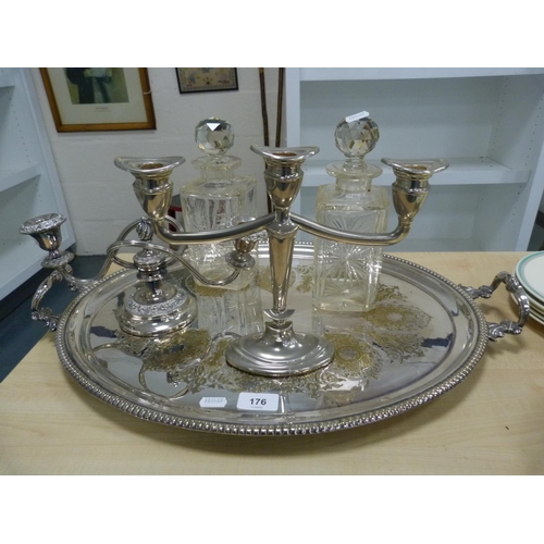 176 - EP oval serving tray, EP candle sconce, white metal candelabrum and two cut glass decanters with sto... 