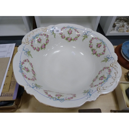 180 - Pottery toilet bowl decorated with garlands of pink roses, with a matching soap dish.