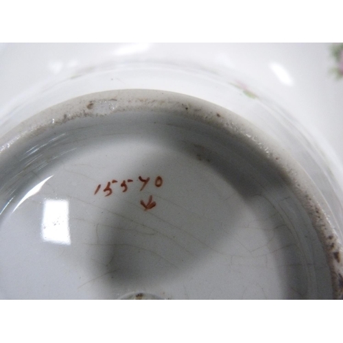 180 - Pottery toilet bowl decorated with garlands of pink roses, with a matching soap dish.