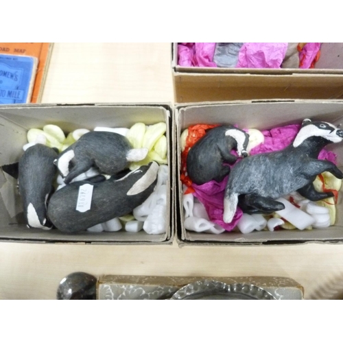 184 - Group of painted terracotta animal figures including badgers, deer, rabbits, etc., boxed.