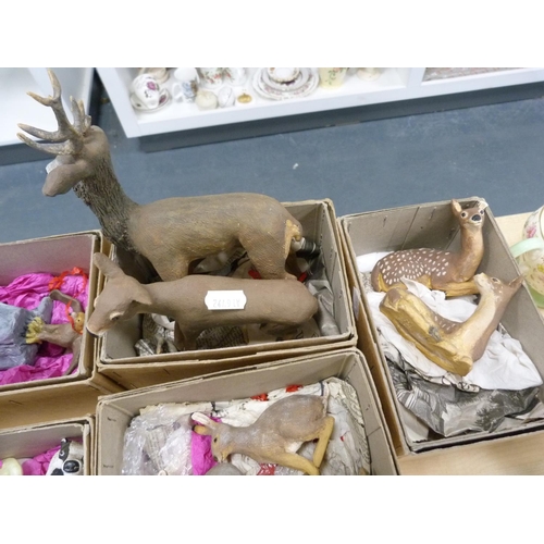 184 - Group of painted terracotta animal figures including badgers, deer, rabbits, etc., boxed.