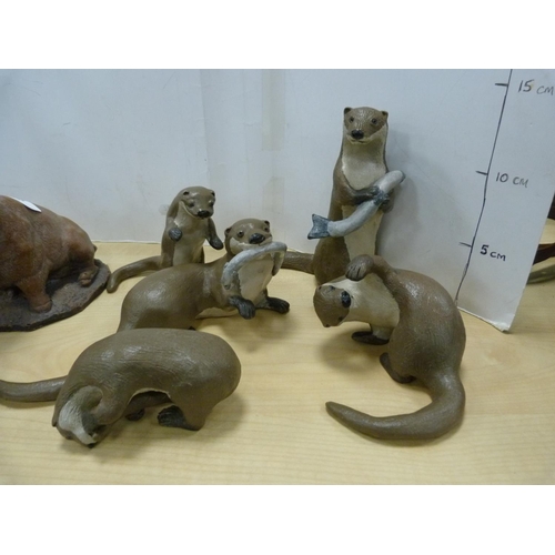 192 - Group of animal figures including otter with fish, pig, snake, mice etc.