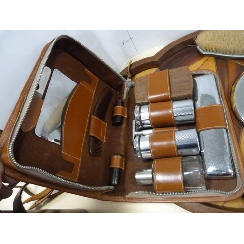 194 - Three-piece dressing table set, cased gent's travel set and a marquetry serving tray.