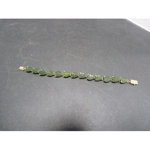 232 - Jade-type bracelet with leaf decoration, stamped '14k'.