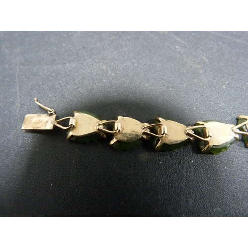 232 - Jade-type bracelet with leaf decoration, stamped '14k'.