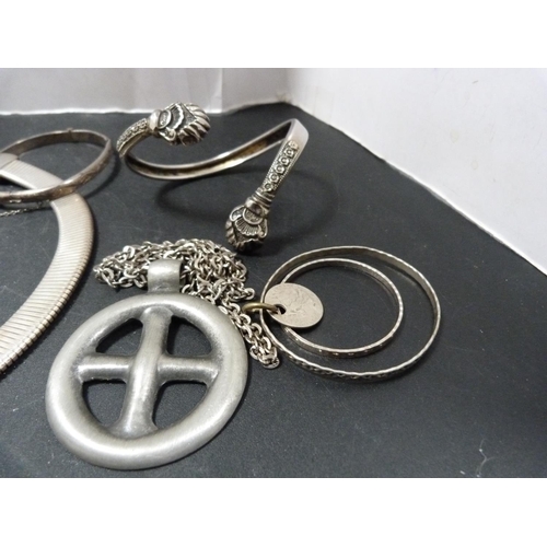 239 - Silver and other bangles, pendant and choker.