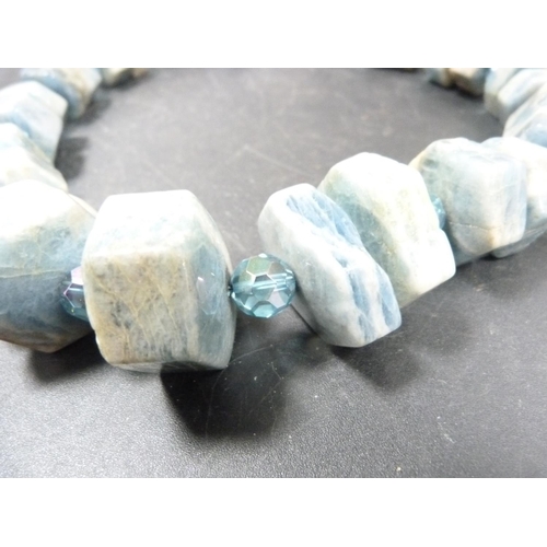 242 - Turquoise coloured pebble-effect bead necklace with interspersed glass beads, with white metal clasp... 