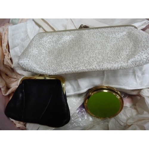 261 - Pair of lady's gloves, evening bag, purse, compact and a collection of linen contained in a hat box.