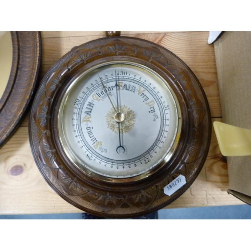 69 - Two wall-mounted barometers and an embroidered panel depicting a Roman-style figure in an oak frame.... 