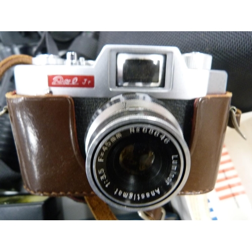 74 - Canon AE1 camera with manual, also a tripod, Hanimex lens and an Ozeck lens, Vivitar flash gun and a... 