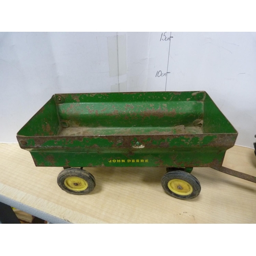 8 - Painted metal model of a John Deere tractor with trailer.