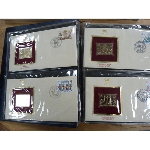 95 - Folder containing 22ct golden replicas of British stamps.