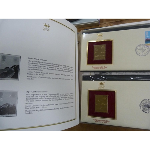 97 - Folder containing 22ct golden replicas of British stamps.