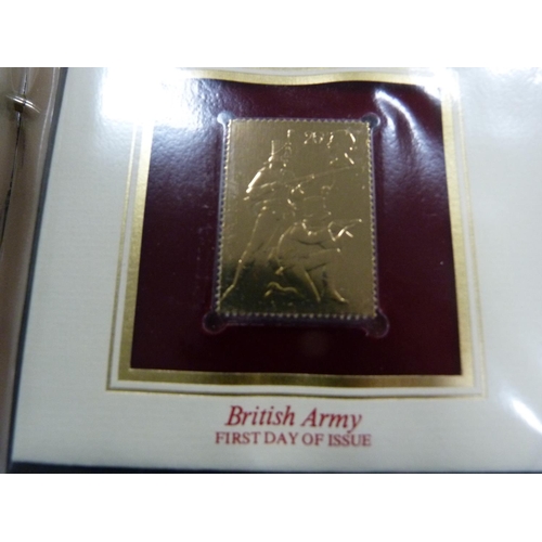 97 - Folder containing 22ct golden replicas of British stamps.