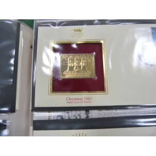 98 - Folder containing 22ct golden replicas of British stamps.