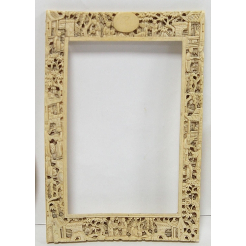 332 - 19th century Chinese Canton carved ivory frame profusely decorated with figures and pavilions amongs... 