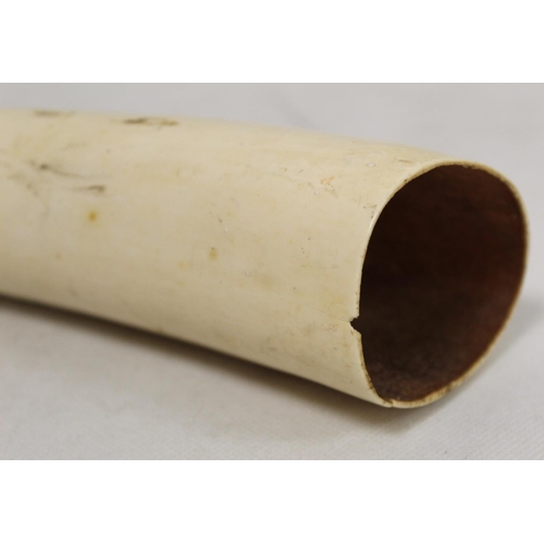 336 - Late 19th/early 20th century African carved ivory pipe with mask terminal and ribbing to body, 45cm ... 