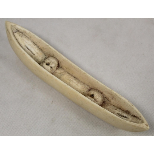 336 - Late 19th/early 20th century African carved ivory pipe with mask terminal and ribbing to body, 45cm ... 